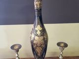 three vases sitting on a table next to each other