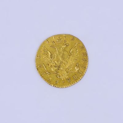 une image d'une pièce d'or sur une surface blanche