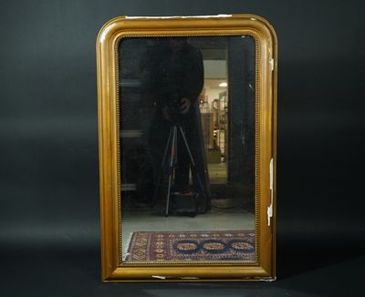 Miroir en bois peint à décor de godrons. France. Style Louis…
