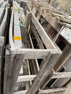 a lot of wooden crates that are stacked together
