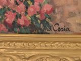 a painting of a vase of flowers in a gold frame