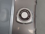 a close up of a cell phone with a button on it