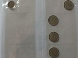 a lot of coins in a plastic bag on the table