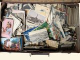 a suitcase full of old postcards and other items