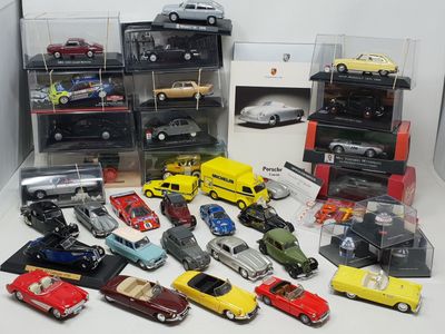 a lot of toy cars that are in a display case