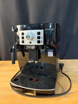 an image of a coffee machine on a wooden table