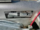 a close up of a motor with a red handle