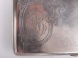 a silver box with a picture of a horse on it