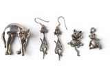 five different metal items that are on a white surface