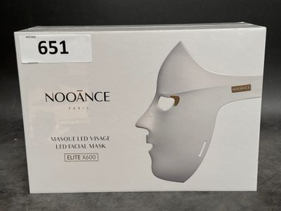 a white box with a white mask on top of it