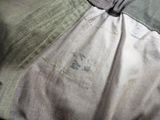 a close up of a piece of clothing on a bed