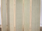 an image of a room divider with four panels on each side of it