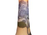 a vase with a tree on it sitting on a table
