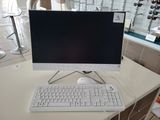 a computer on a desk with a keyboard and mouse