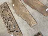 several pieces of wood are laying on the floor next to a pair of scissors