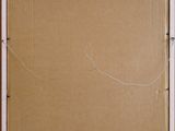 an open cardboard box with a piece of paper taped to it
