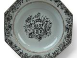 a black and white plate with a floral design on it