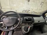 a dashboard of a car with a steering wheel and dashboard controls