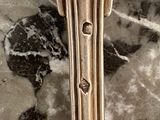 a close up of a spoon on a marble table