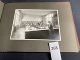 black and white photo of a man standing in a lab