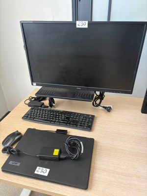 a desk with a monitor, keyboard, mouse and mouse on it