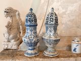three blue and white vases sitting on a table