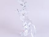 crystal figurine of a horse standing on its hind legs on a white surface