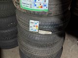 several tires stacked on top of each other in a garage