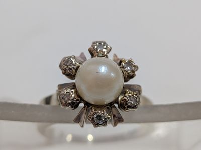 sterling silver ring with a pearl and diamonds