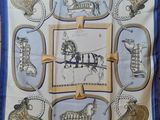blue and white square scarf with a picture of a horse drawn carriage