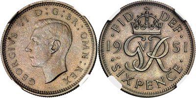 a close up of a coin with a crown on it