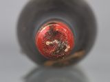 a close up of a bottle of wine on a table