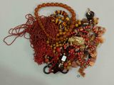 a pile of assorted beads on a white surface