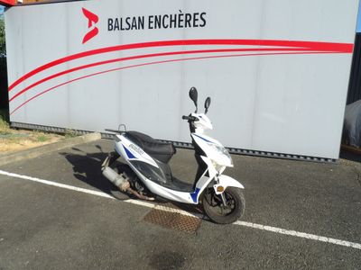 a scooter that is parked in a parking lot