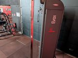 a gym equipment in a gym room with a wall in the background