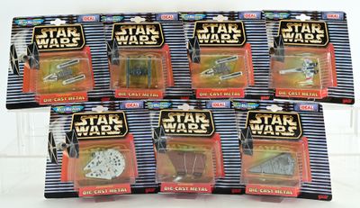 six star wars action figures in plastic bags on a white surface