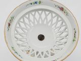 a white plate with a flower design on it