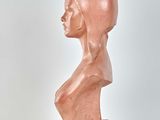 an image of a sculpture of a woman ' s head on a white surface