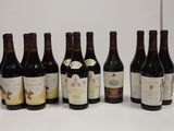 several bottles of wine are lined up on a table
