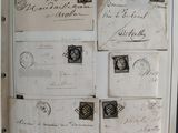a picture of a picture of old letters and stamps on the wall
