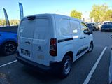 a white van that is parked in a parking lot