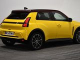 the rear end of a yellow car parked in a room