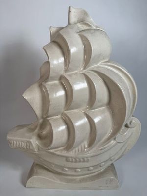 sculpture of a white ship on a stand on a white background
