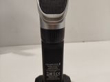 an electric hair clipper sitting on top of a white table