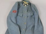 an image of a blue jacket with a red emblem on it