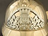 a silver helmet with a crown on top of it