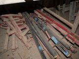 a pile of old tools on the floor in a room