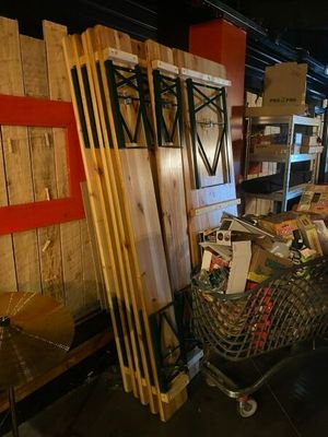 a cart full of books and other items in a room