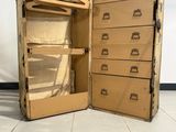 an open suitcase sitting on the floor next to a wall