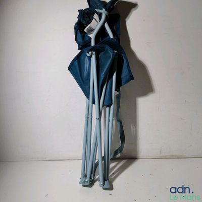 a blue umbrella that is hanging on a wall